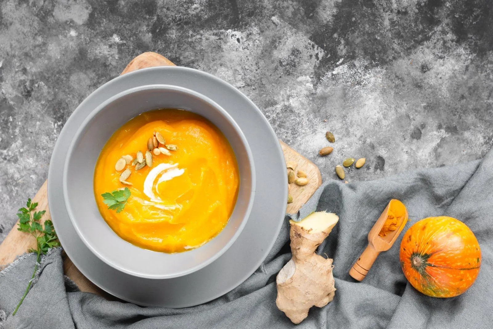 Creamy pumpkin and ginger soup garnished with seeds